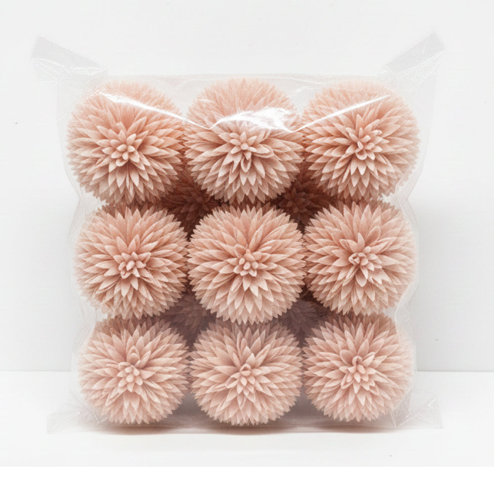 Pack of pink pom-poms in clear packaging on a white background