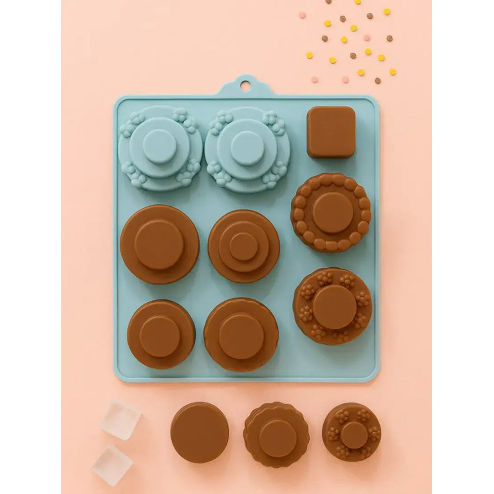 Silicone mold with cookie shapes on a pink background
