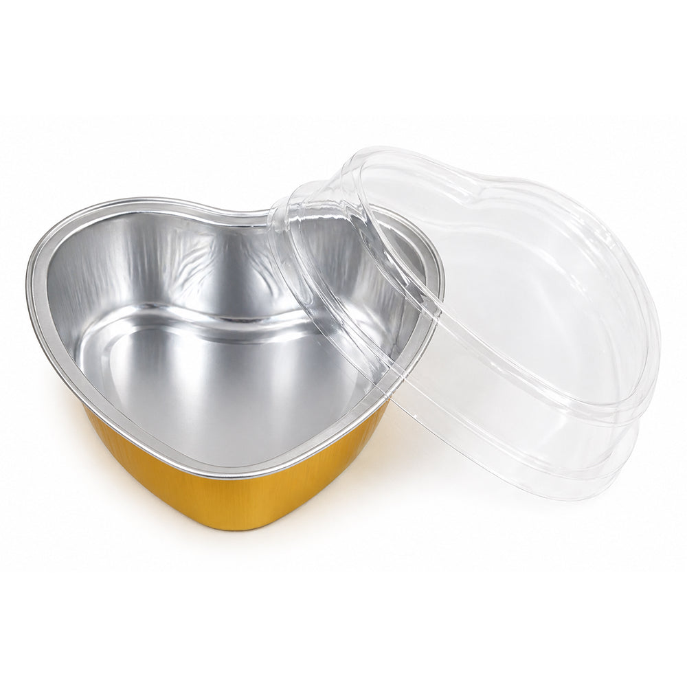 Heart-shaped metal container with a clear lid on a white background