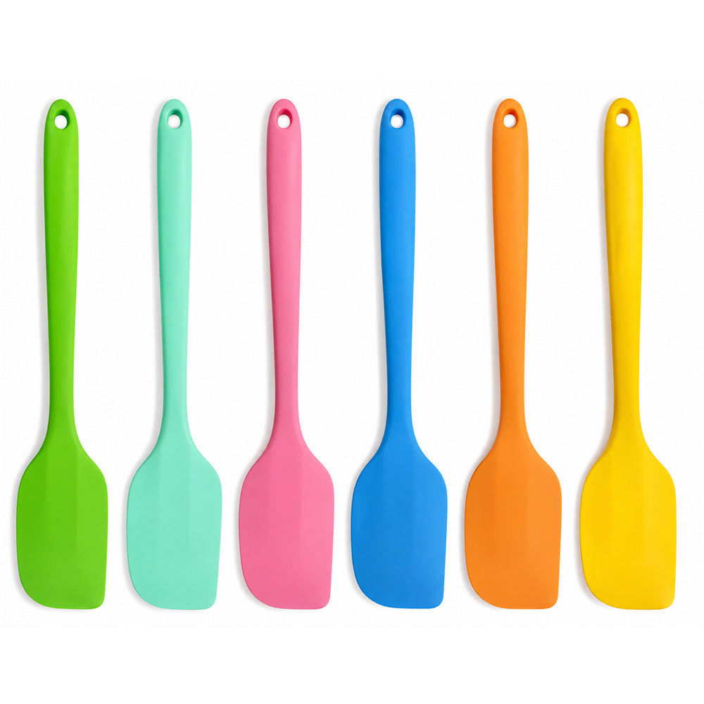 Set of colorful silicone spatulas on a white background