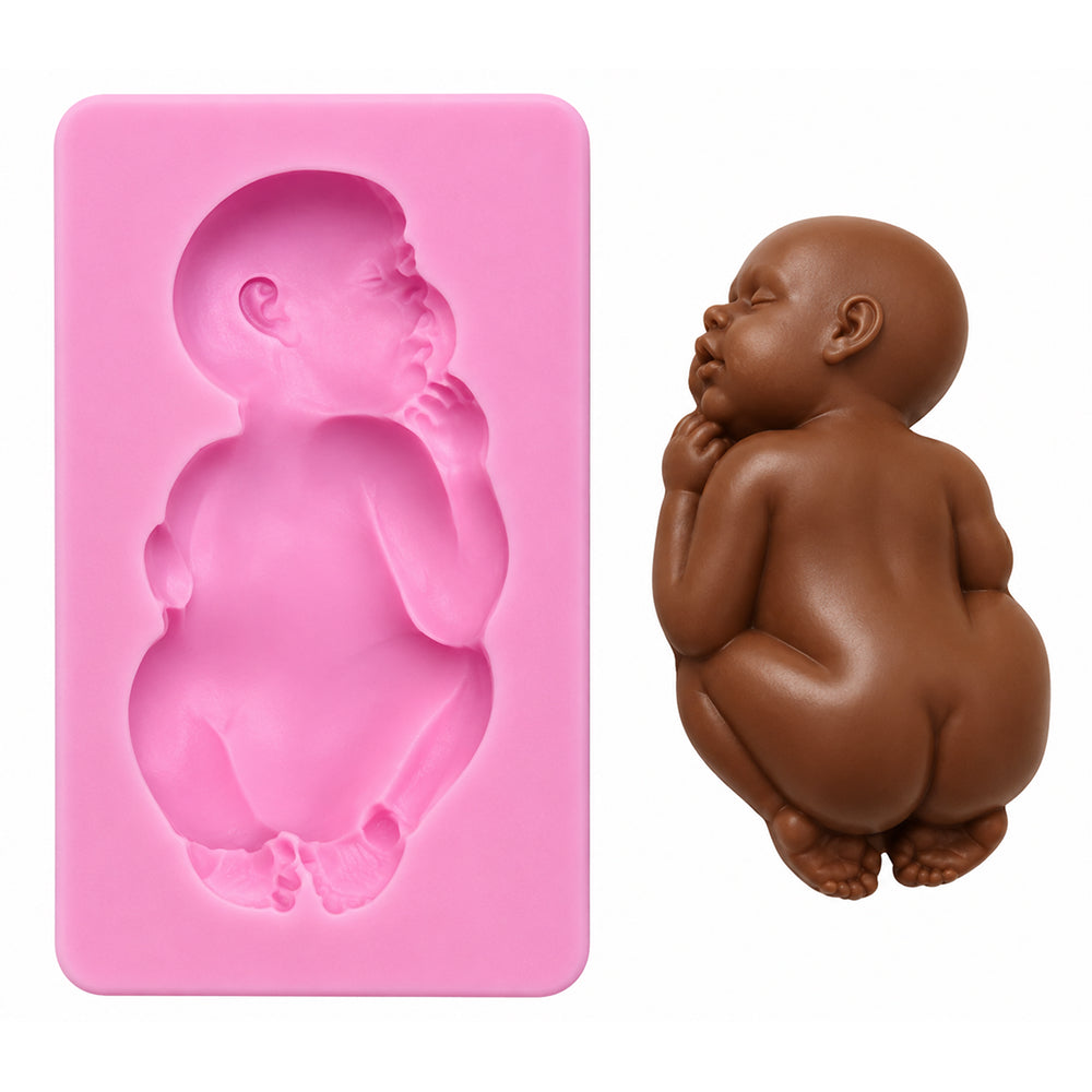 Pink silicone mold shaped like a baby next to a chocolate baby figurine on a white background