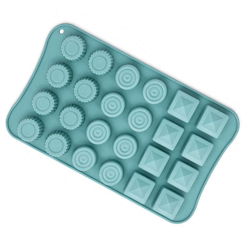 Teal silicone mold with various shapes on a white background