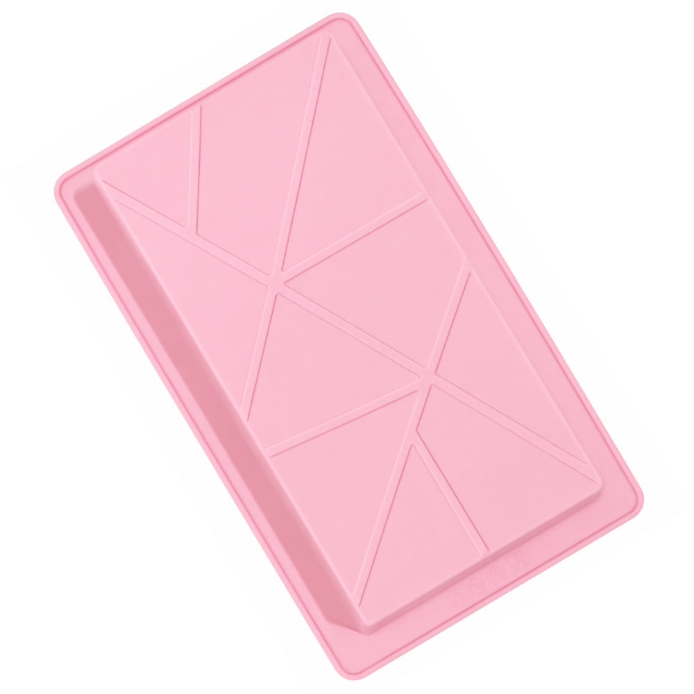 Pink silicone mold with geometric patterns on a white background