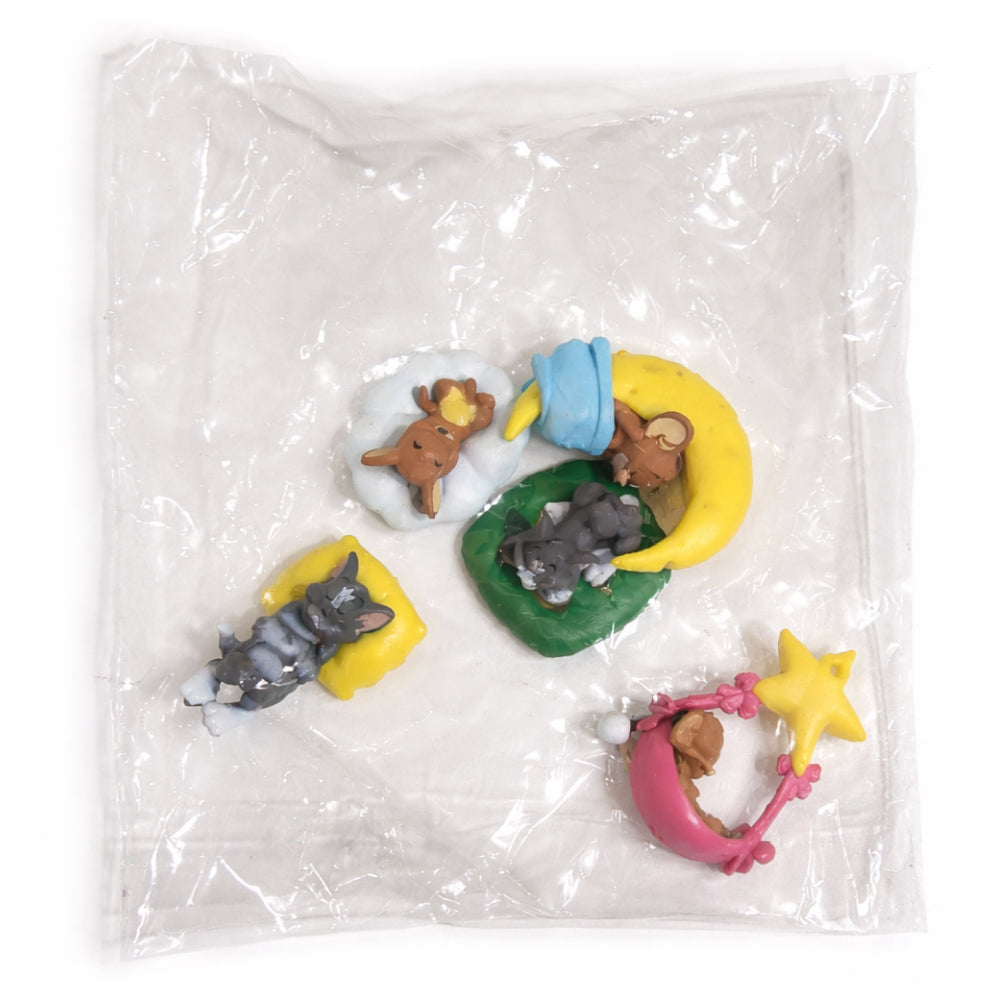 Set of small Tom N Jerry figurines in a clear plastic bag on a white background
