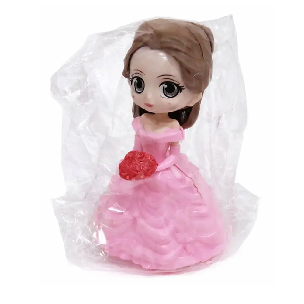 Plush toy in a pink dress with a red flower, wrapped in clear plastic on a white background