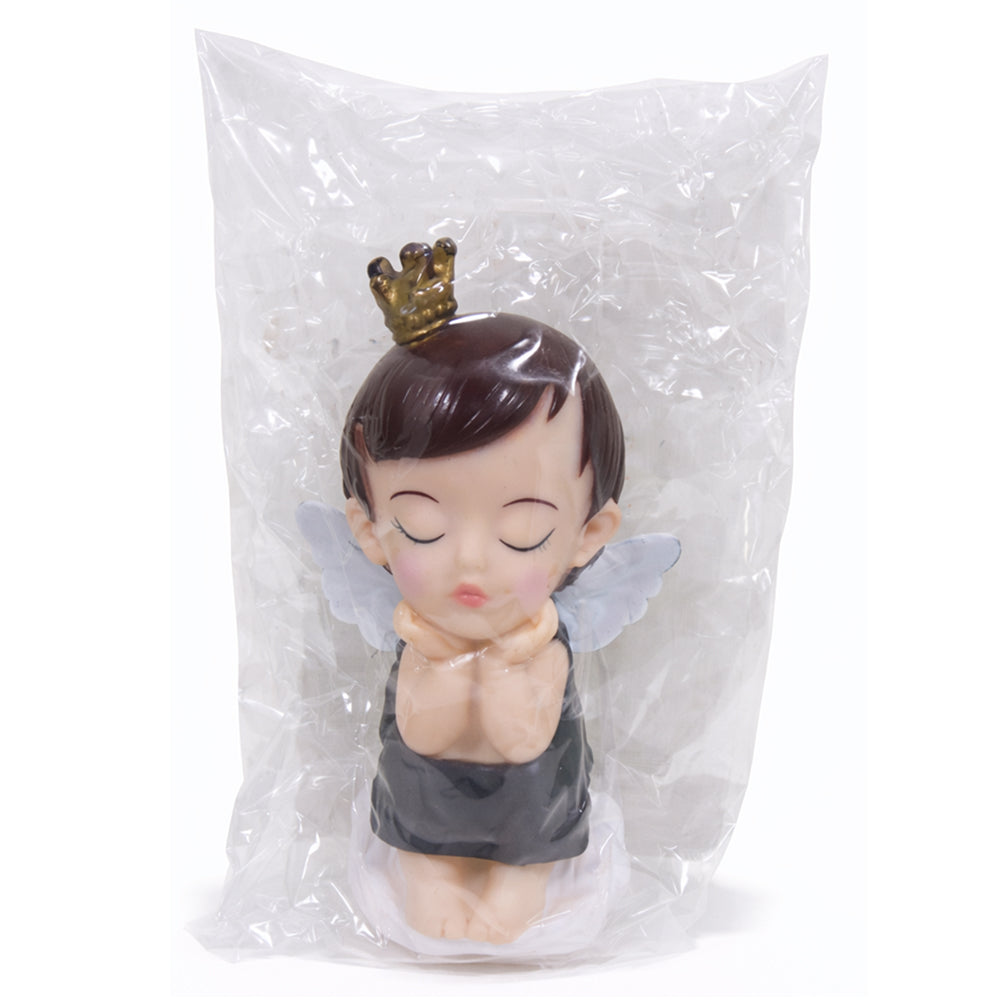 Toy figure of a fairy with a crown in a clear plastic bag on a white background
