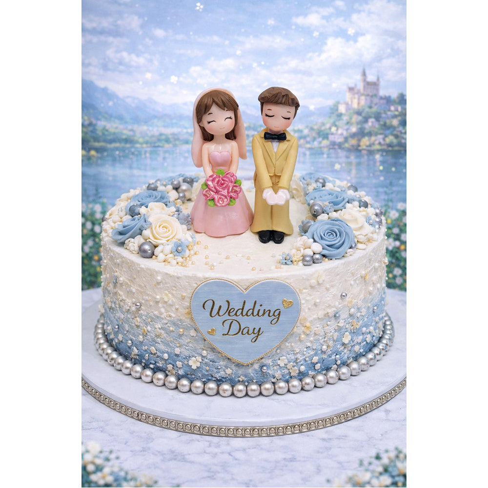Decorative wedding cake with Miniatures of a couple and 'Wedding Day' heart on a scenic background.
