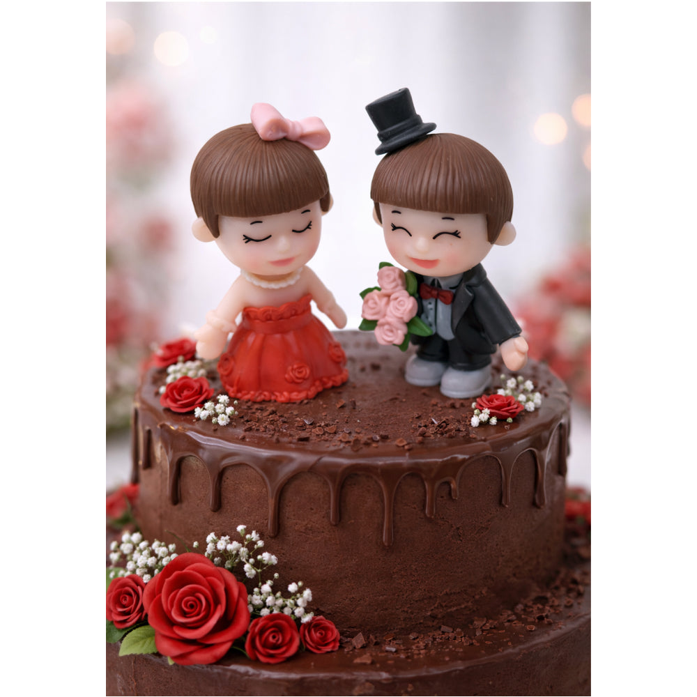 Chocolate cake with Miniatures of a couple and red roses on a white background