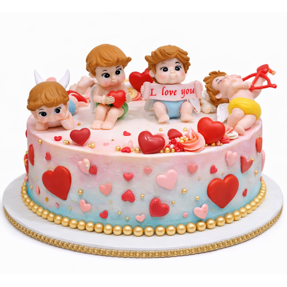 Decorative Miniatures cake with cherub figurines and heart designs on a white background