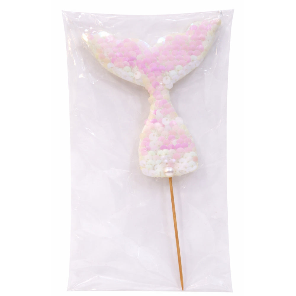 Mermaid tail cake topper with pink and white scales on a white background