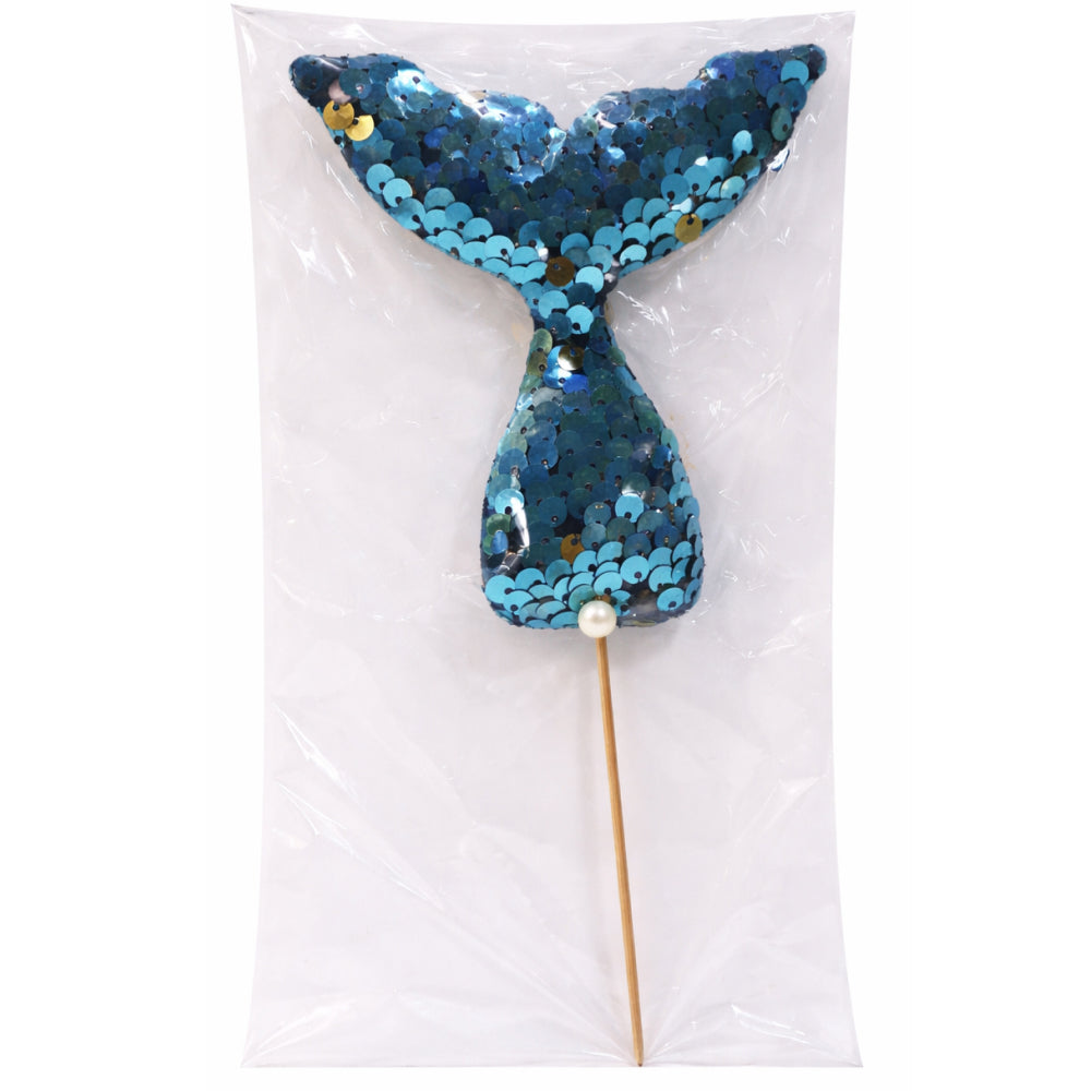 Blue sequin mermaid tail on a stick with a white background