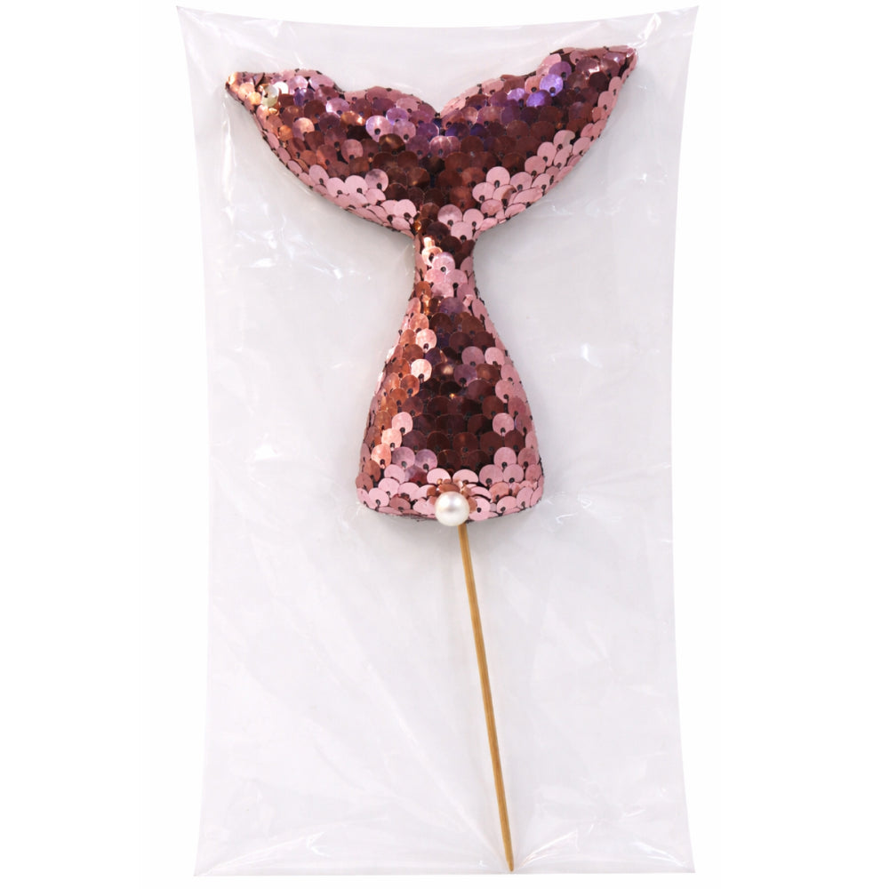 Sequined mermaid tail on a stick with a pearl accent, against a white background.