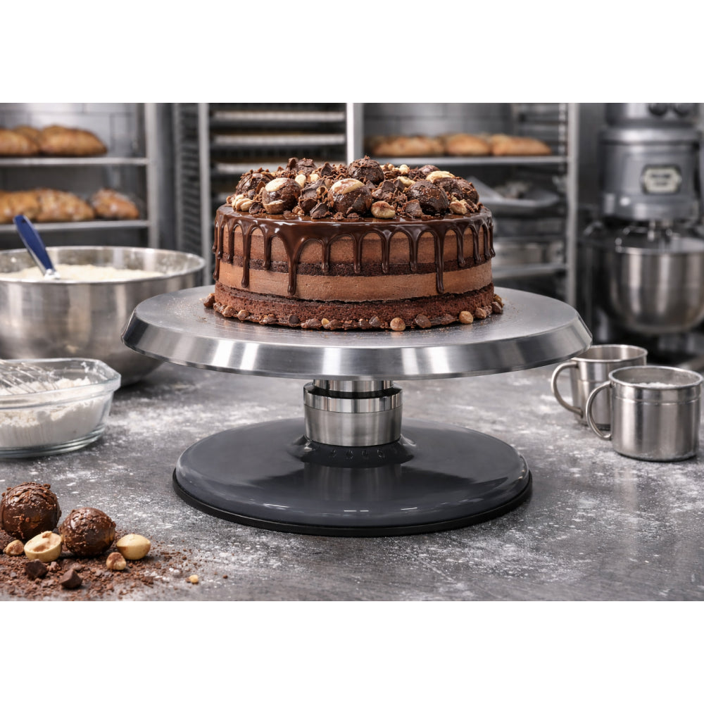 Chocolate cake on a turntable in a bakery setting