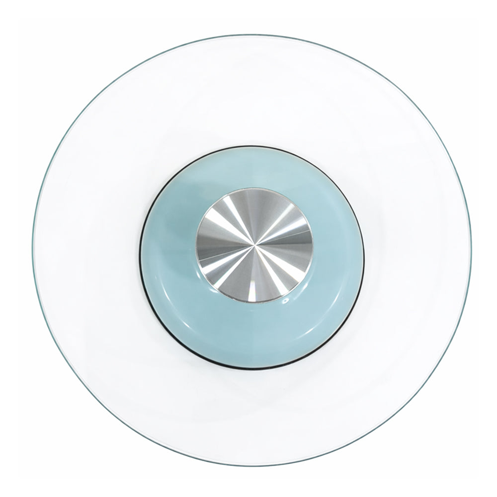 Round glass plate with a metallic center on a white background