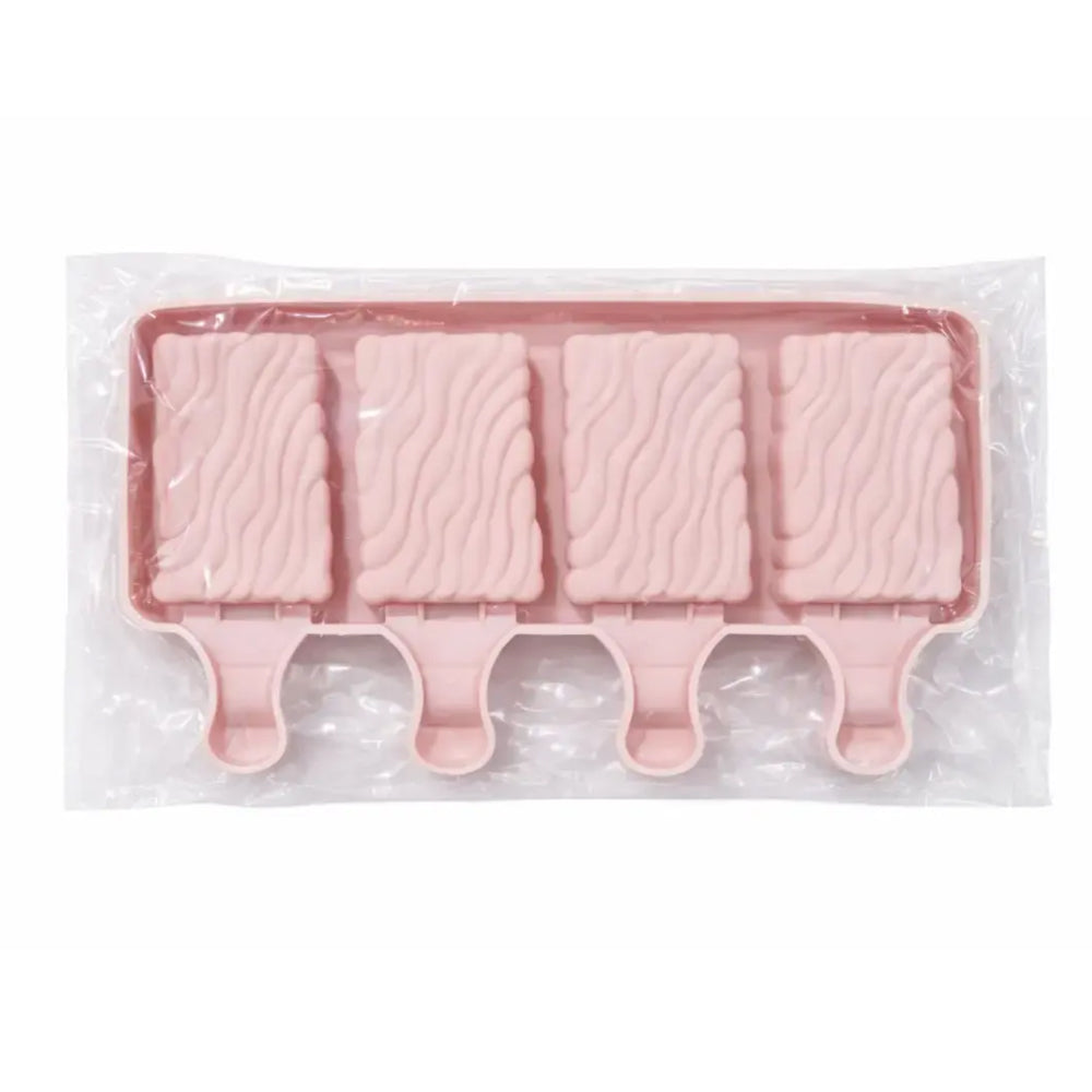 Pink ice cream mold with four cavities on a white background