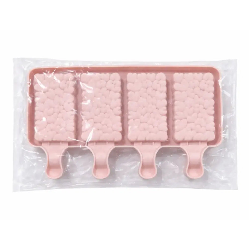 Pink silicone mold for popsicles in clear packaging on a white background