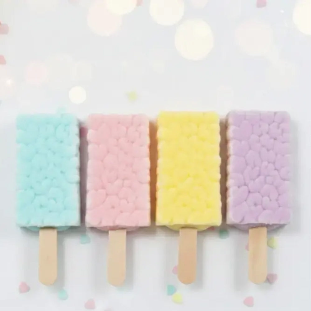 Four colorful popsicle-shaped cookies on a light background