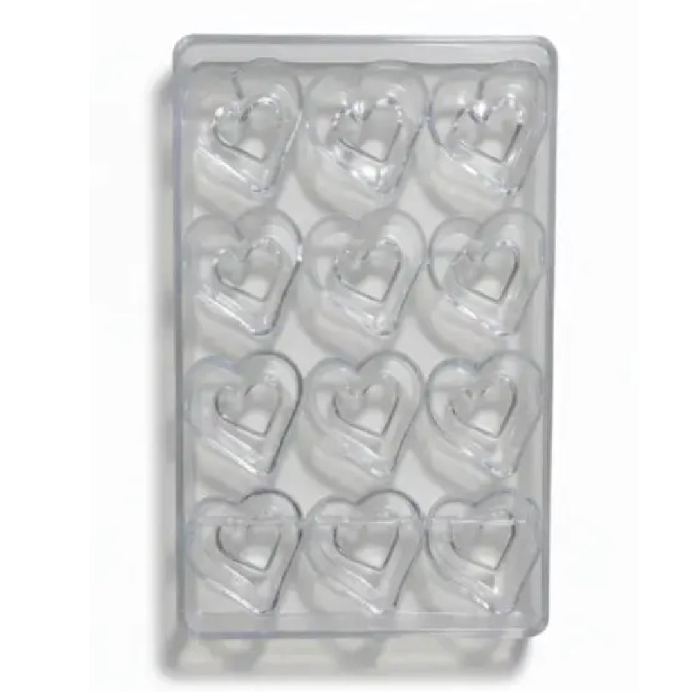 Polycarbonate mold with heart shapes on a white background