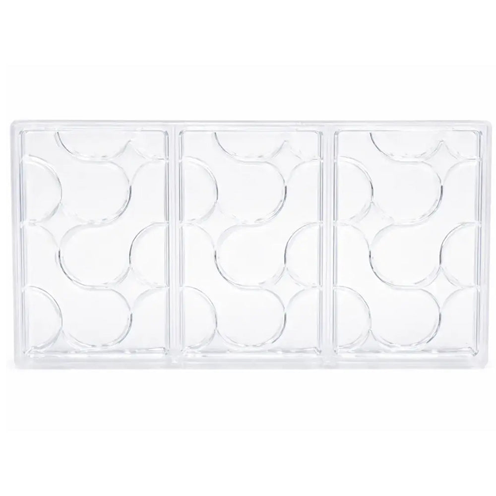 Polycarbonate chocolate mold with rounded pattern on a white background