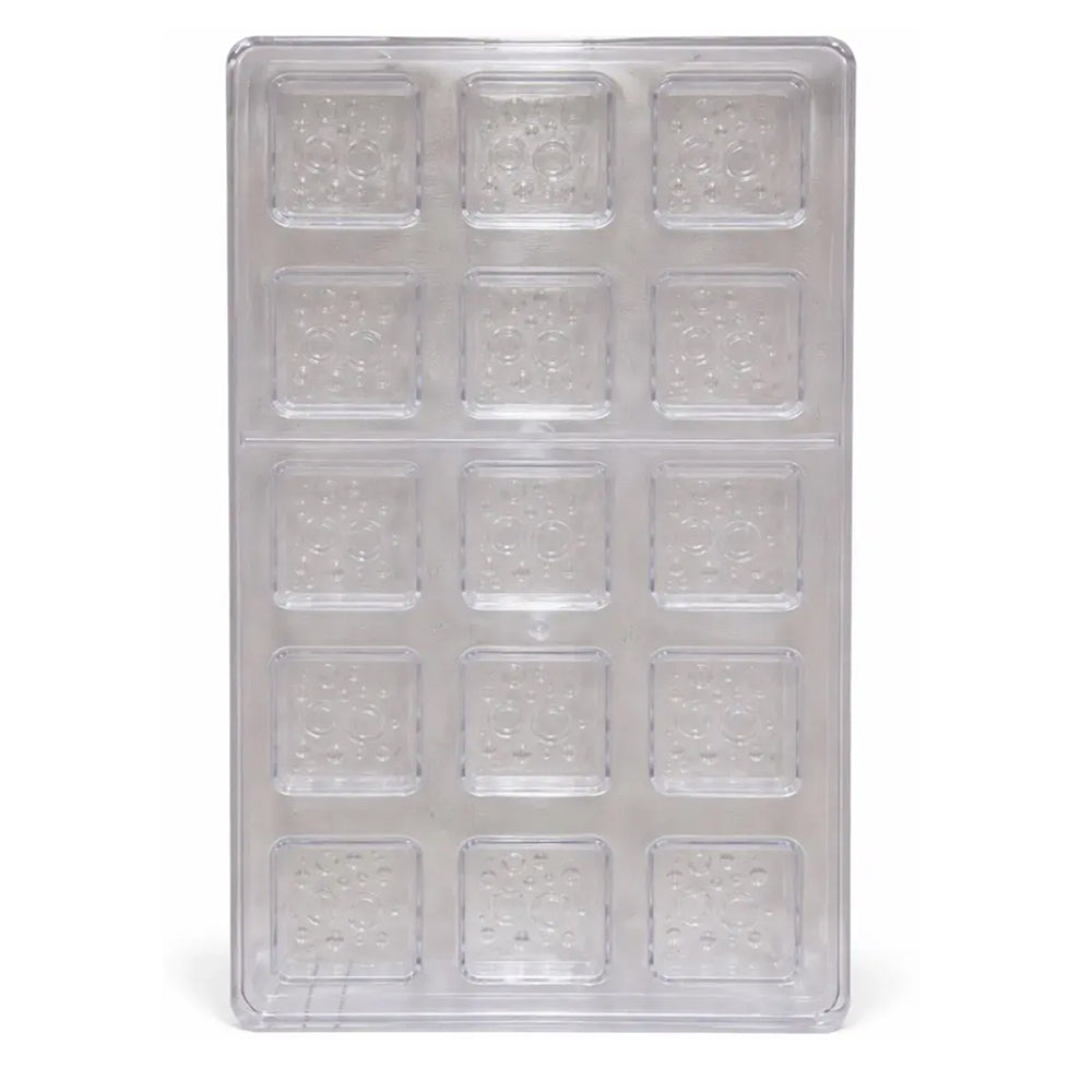 Polycarbonate mold with square cavities on a white background