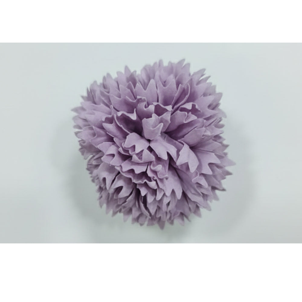 Purple tissue paper pom-pom on a white background