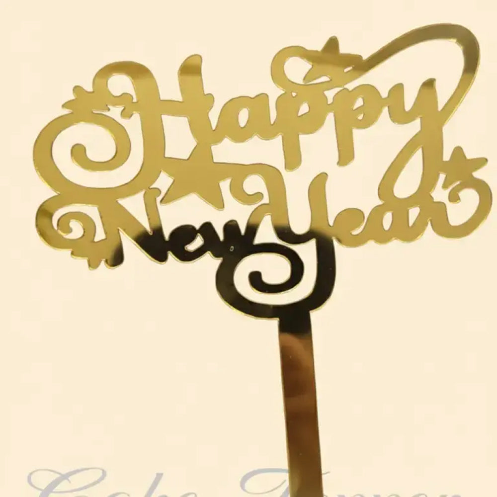 Gold 'Happy New Year' decorative item on a beige background
