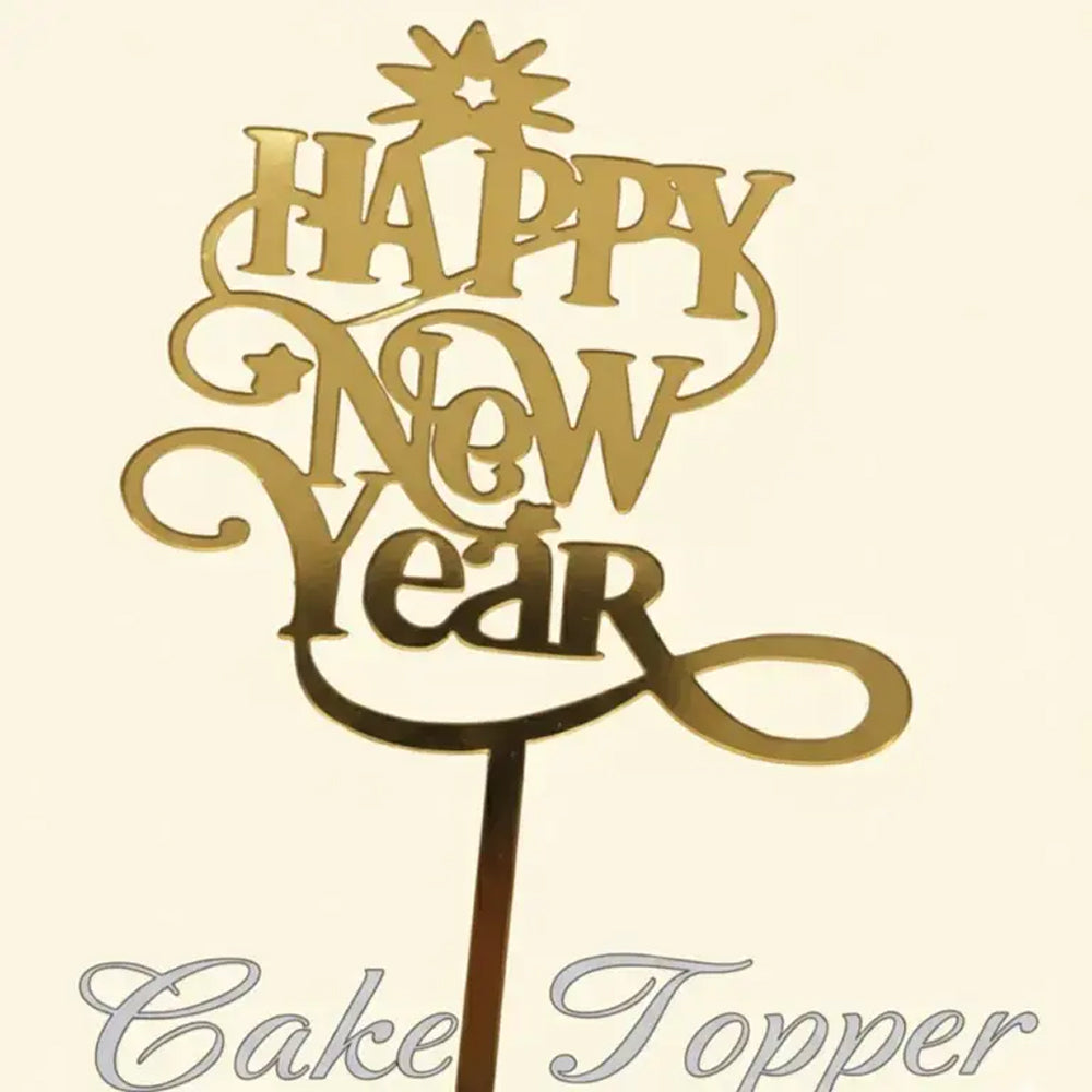 Gold 'Happy New Year' cake topper on a beige background