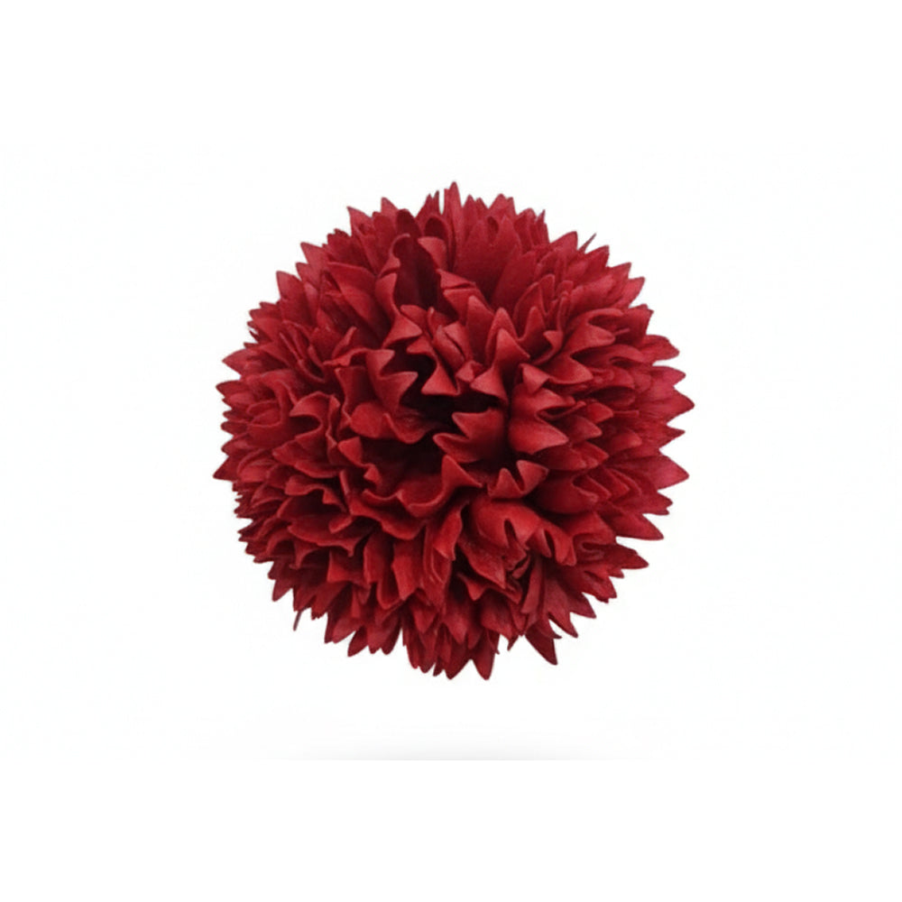 Red decorative pom-pom on a white background