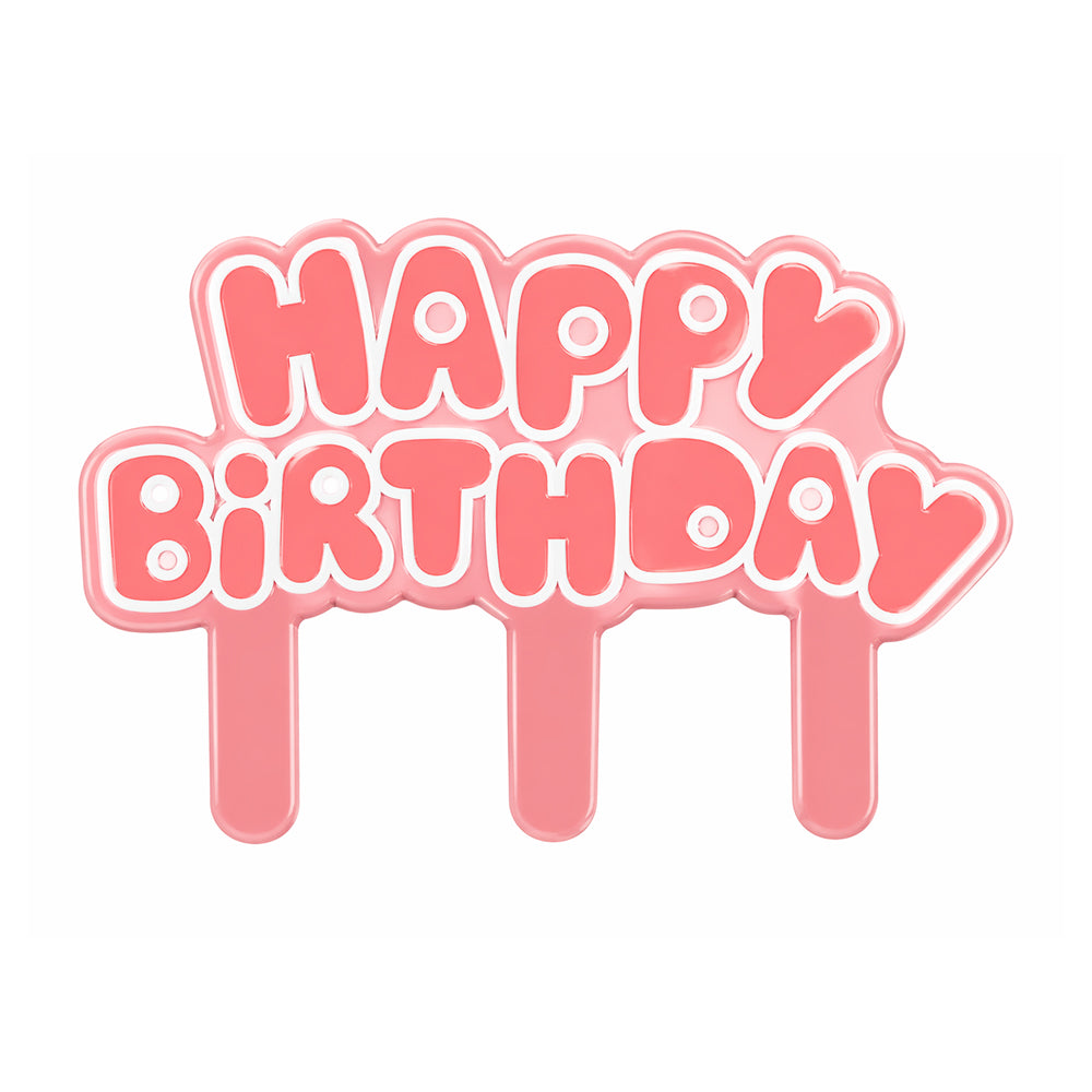 Pink 'Happy Birthday' cake topper on a white background