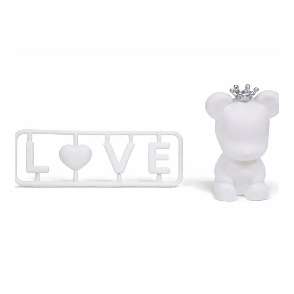 White teddy bear with a crown and 'LOVE' sign on a white background