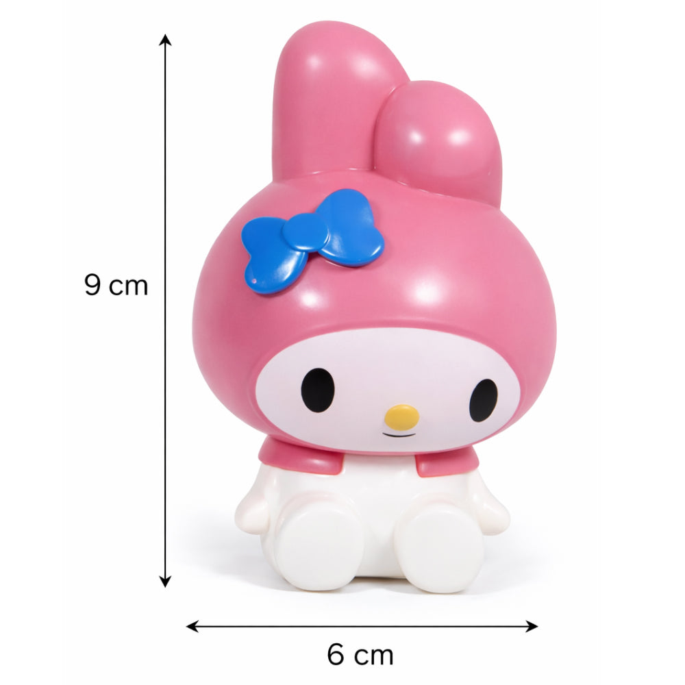Pink cartoon character with a blue bow, shown with measurements on a white background