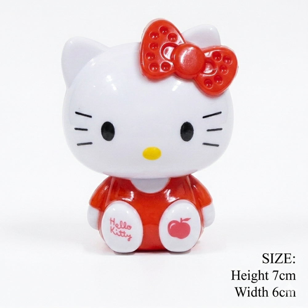 Hello Kitty figurine with red bow and outfit on a white background