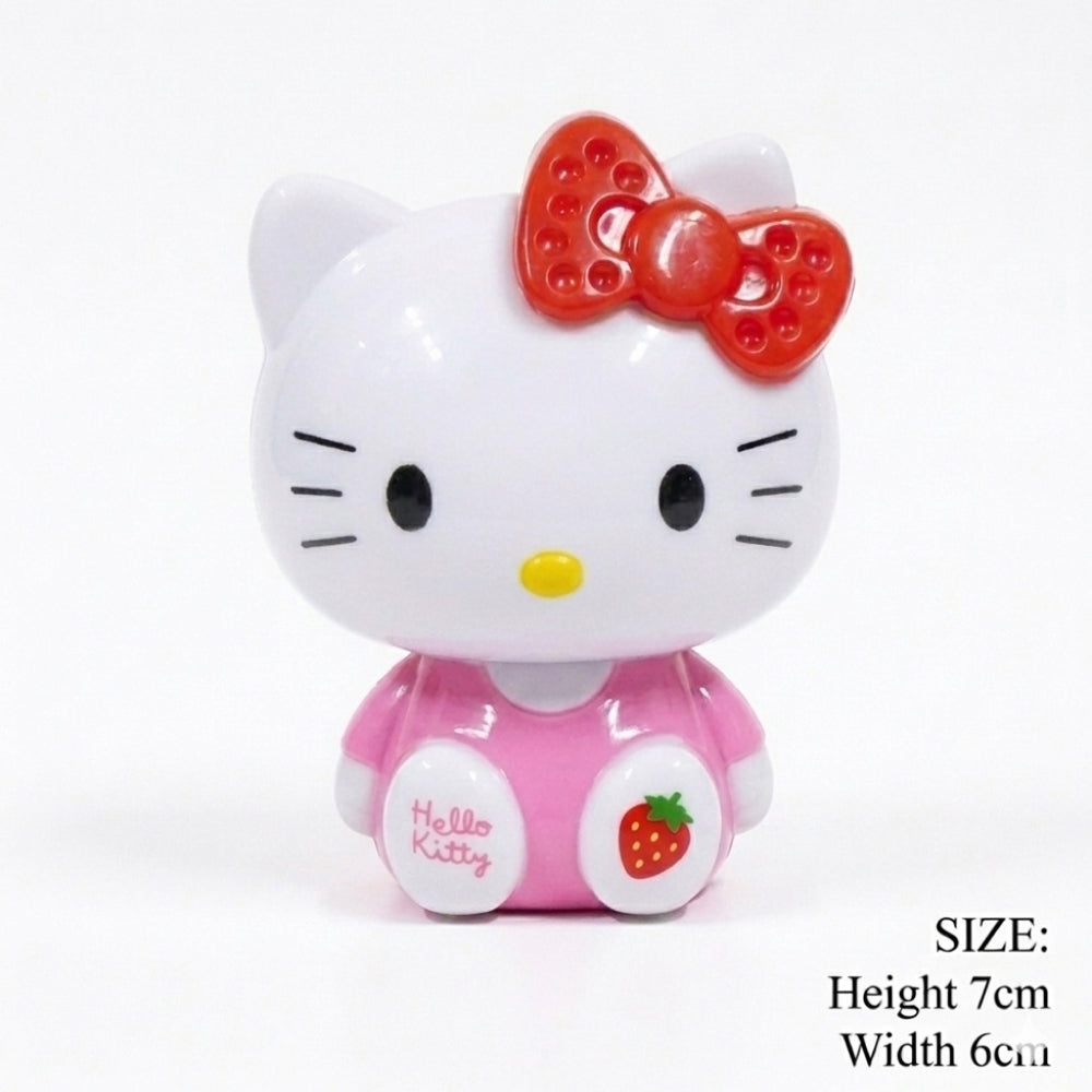 Hello Kitty character figurine with a red bow on a white background