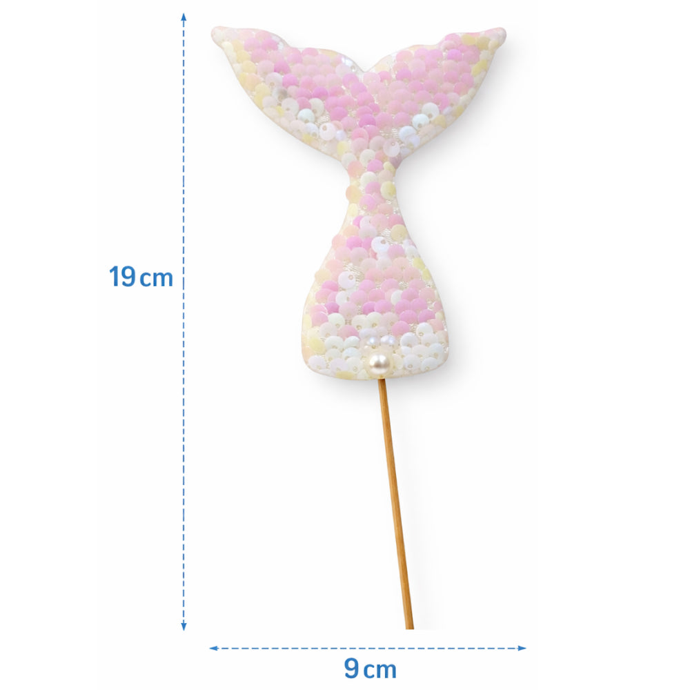 Decorative mermaid tail on a stick with measurements on a white background