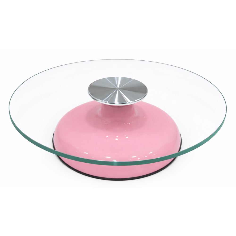 Round glass turntable with pink base and silver top on a white background