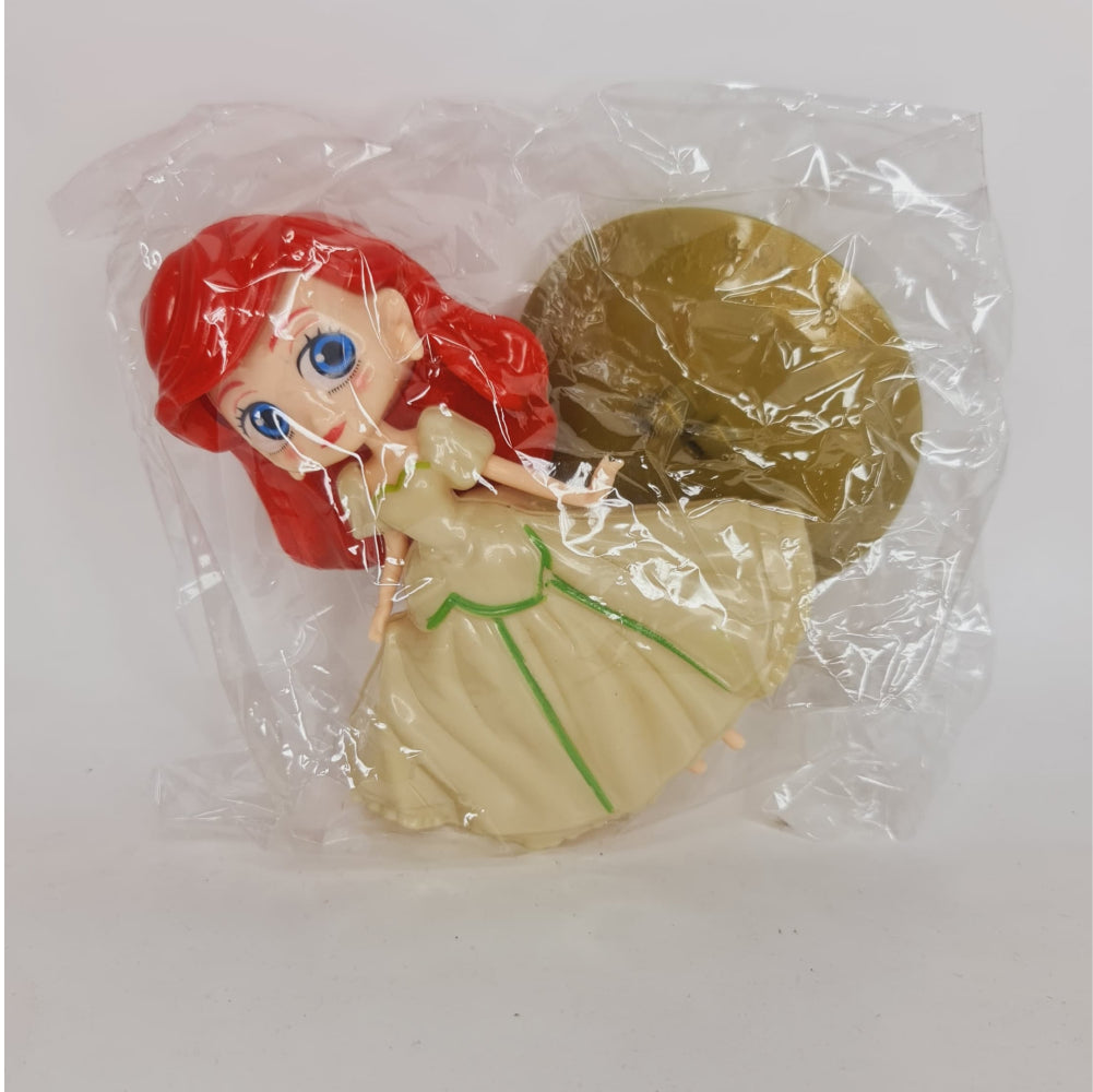 Girl With Gown Cake Toy Topper in packaging displayed on clean background
