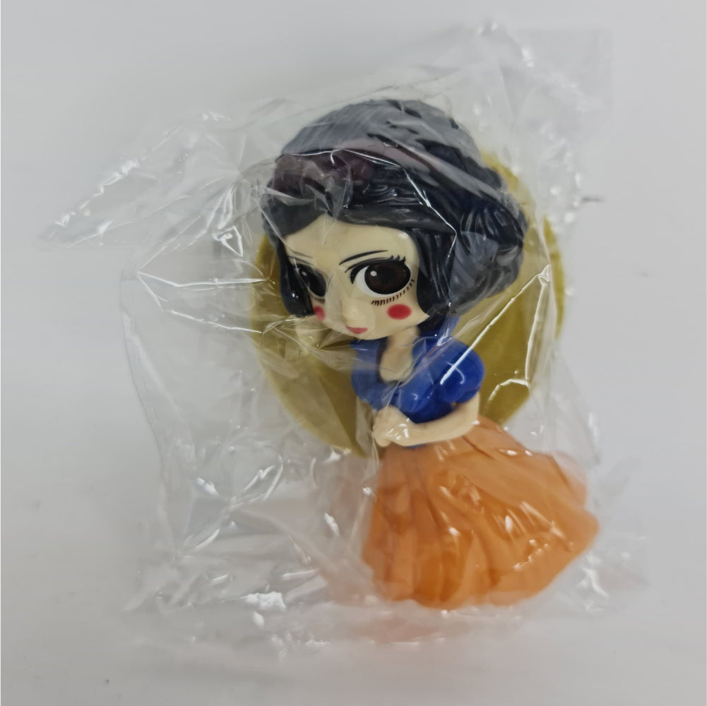 Girl With Orange Frock Miniature Cake Toy Topper in packaging displayed on clean background