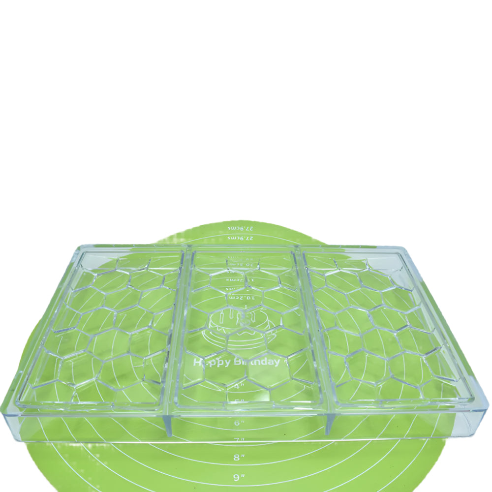 Hexagon Shape Polycarbonate Chocolate Bar Mold placed on a green baking mat against a white background for a detailed view.