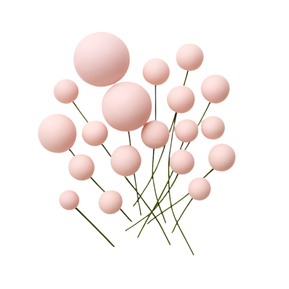 A set of decorative Light Pink faux balls spread evenly on a white background, showcasing their color and texture for cake decoration.