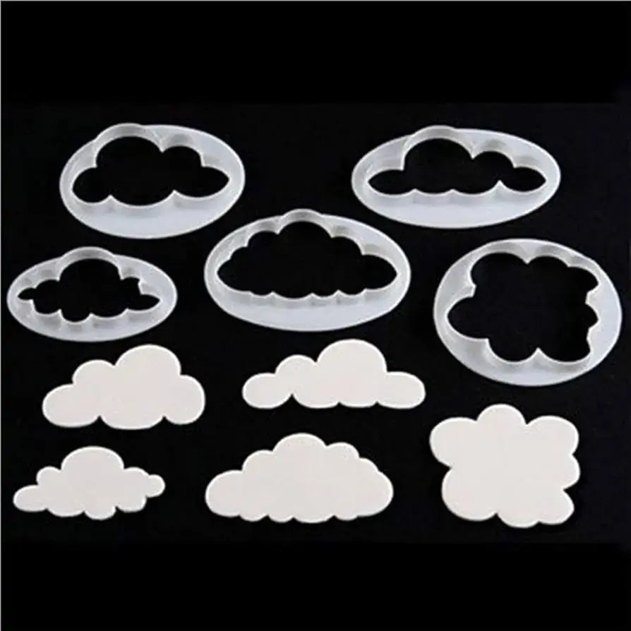 Set of cloud-shaped cookie cutters on a black background