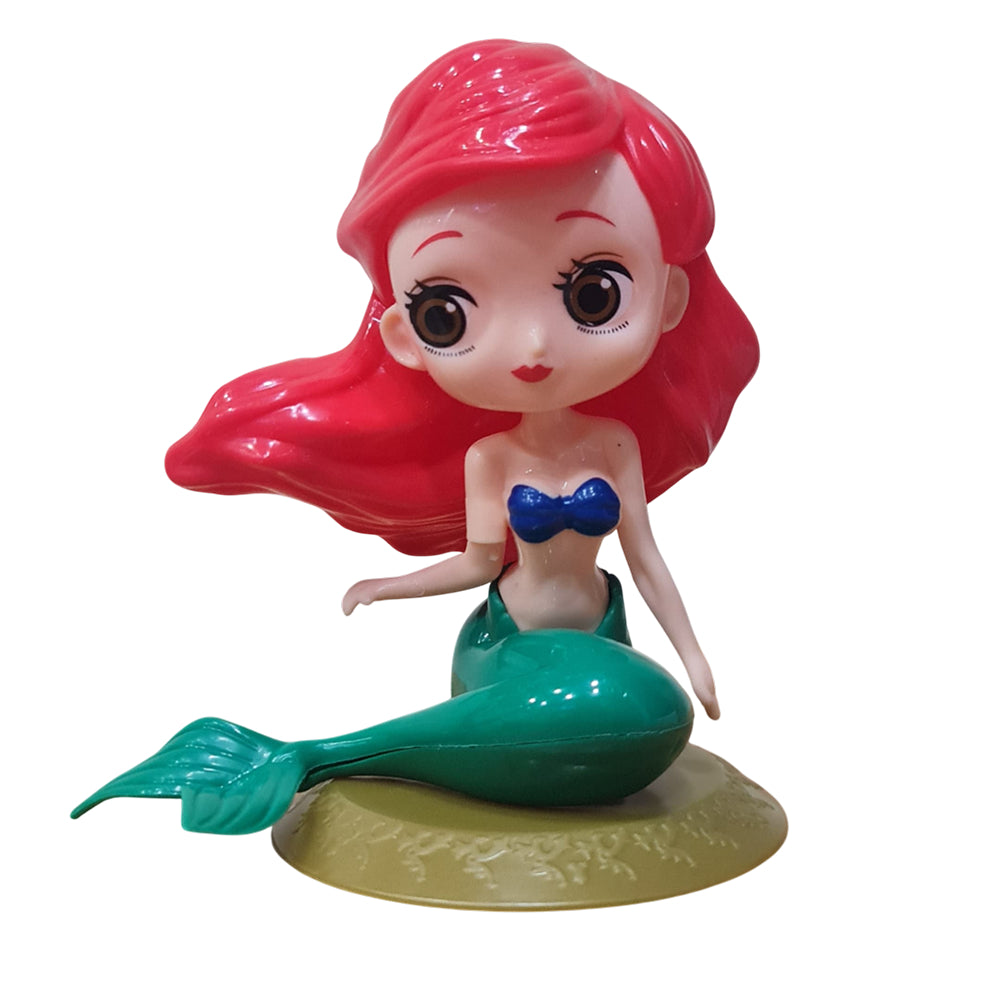 Close-up of Mermaid Cake Toy Topper on white background