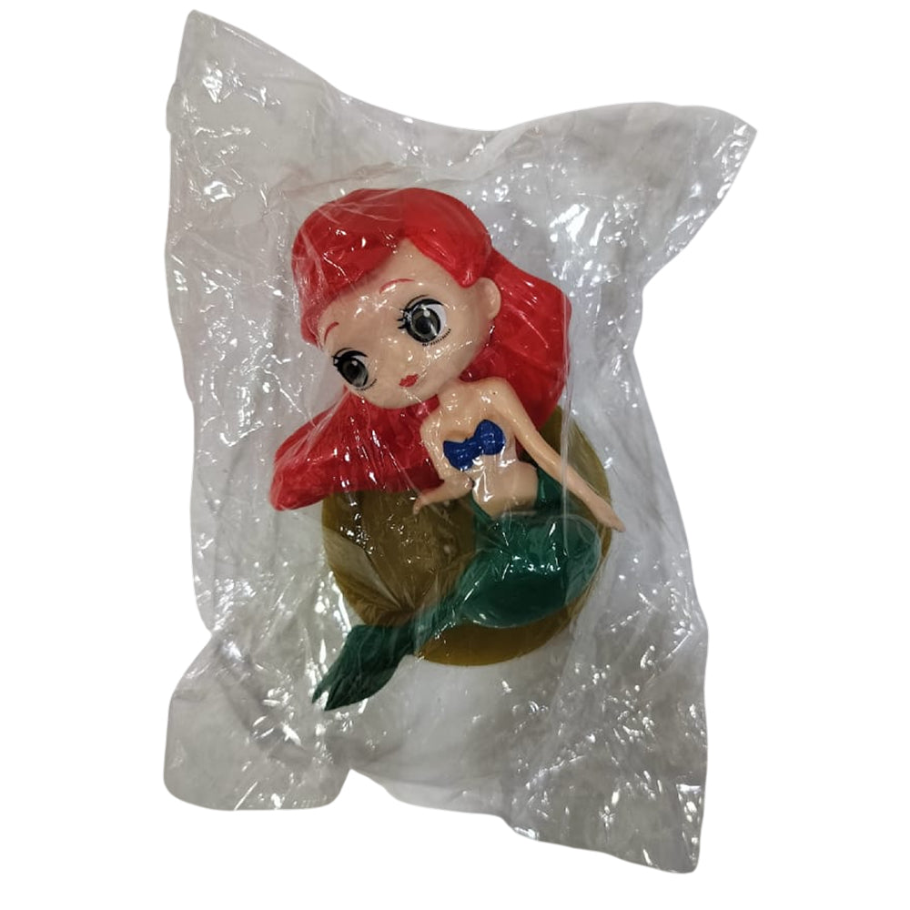 Angled zoomed-in view of Mermaid Cake Topper in packaging on white background