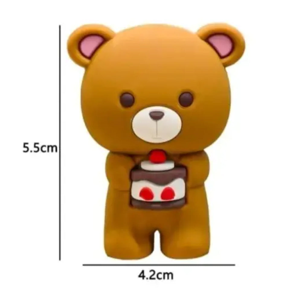 Miniature 5.5cm x 4.2cm brown teddy bear cake topper holding a chocolate-layered slice with a cherry and red decorations, designed with a flat base, big head, pink ears, and minimal features – ideal for DIY cake decoration, birthday parties, or themed fondant topper collections