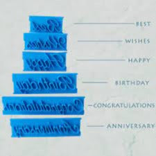 Set of blue plastic letters spelling out 'Congratulations' on a white background