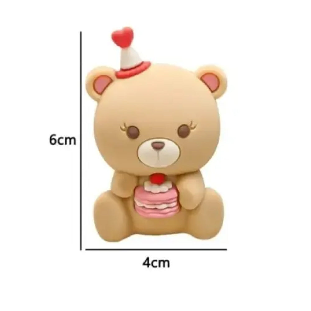 Cute Bear Miniature 6cm tall and 4cm wide teddy bear cake topper for cakes and desserts, showcasing a sweet brown bear with fluttery eyelashes, with it's size, a red and white party hat with a heart top, and a triple-layer pink cake with red cherry, designed for baby showers, girls’ birthdays, or romantic cake themes – a must-have edible-safe miniature for detailed cake styling