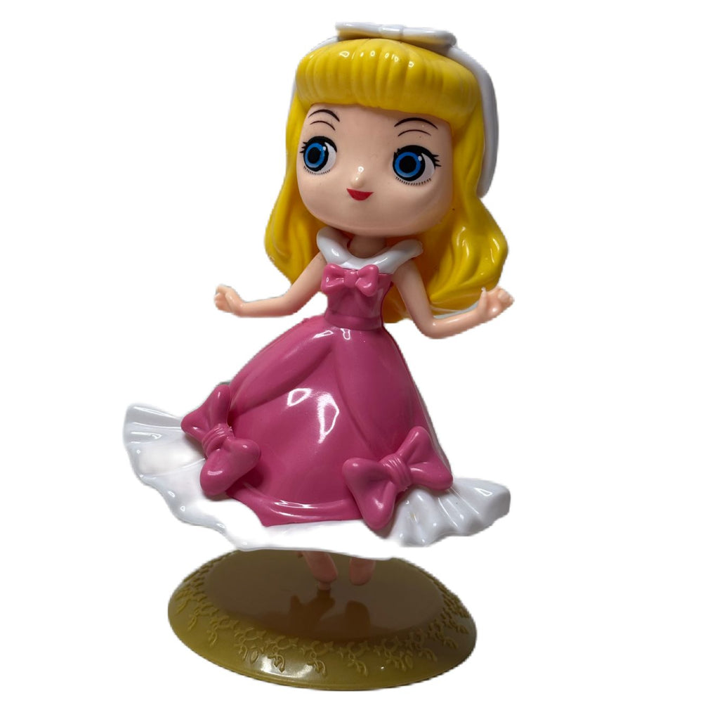 Angled zoomed-in view of Pink with White Frock Doll Cake Topper on white background