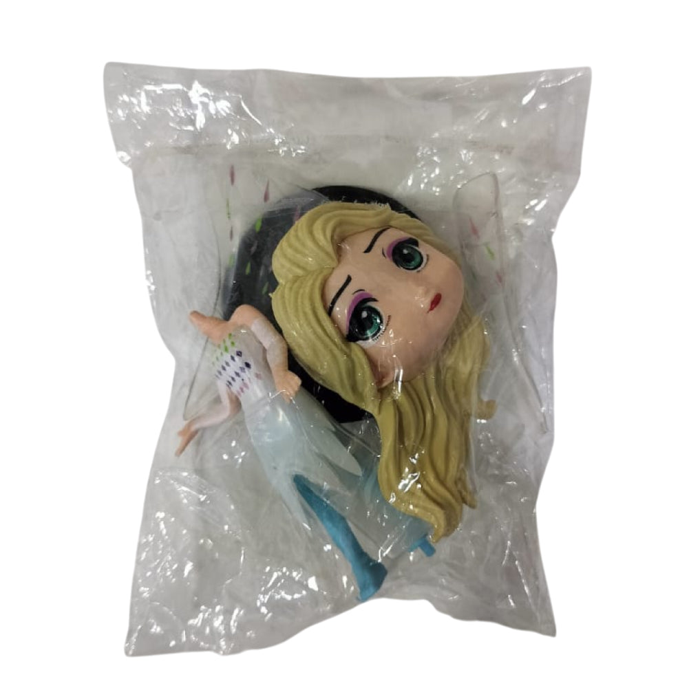 Angled zoomed-in view of Princess Doll Cake Topper in packaging on white background