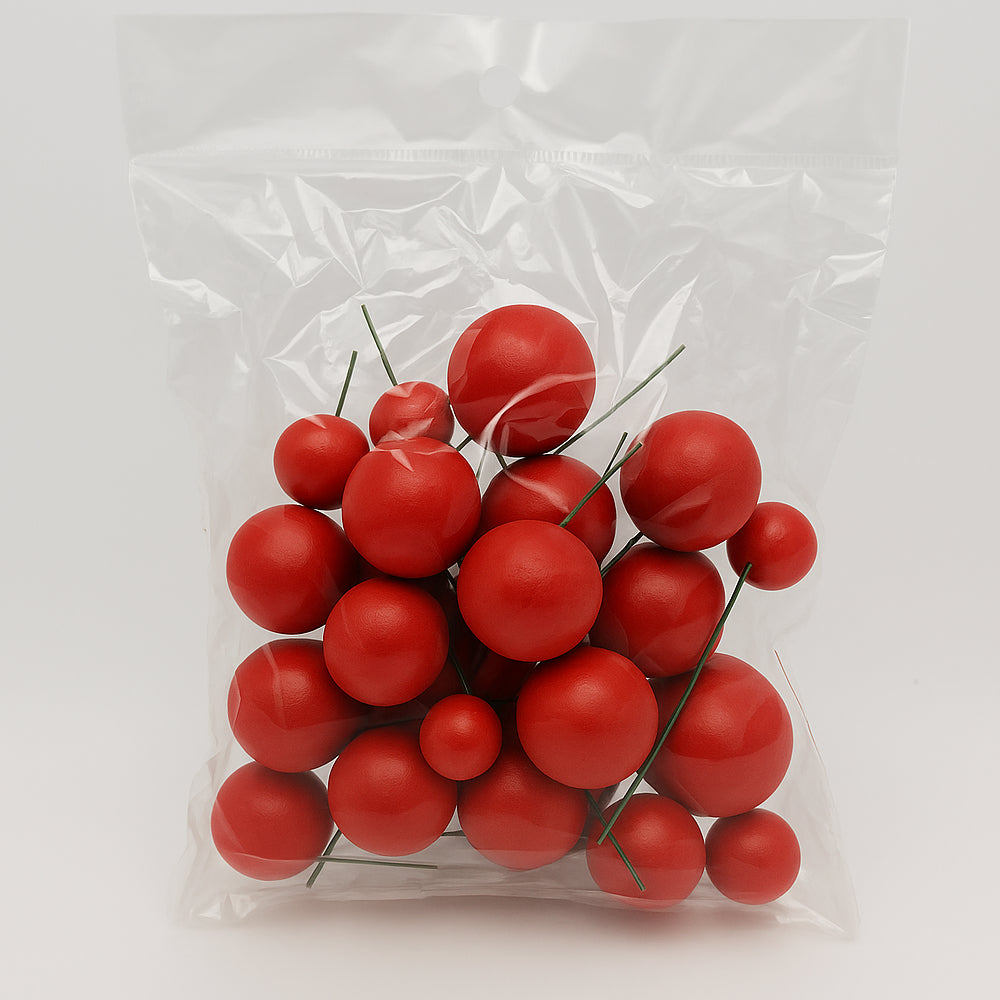 Decorative faux balls displayed on a table in it's packet, perfect for creative cake decorating.