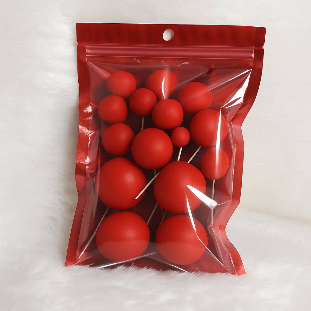 Red matte faux balls in assorted sizes sealed inside a transparent zip-lock packet – ideal for modern cake decoration or DIY crafts