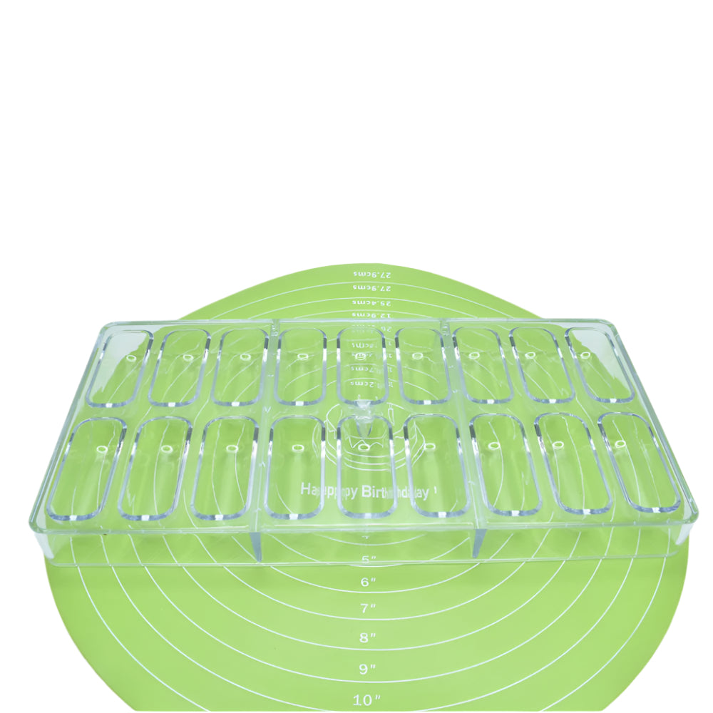 Rounded Rectangle Shaped Polycarbonate Chocolate Bar Mold placed on a green baking mat against a white background for a detailed view.